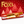 A package of Fox's Crunch Creams Sticky Toffee Pudding Seasonal Edition, shown against a festive red background with Christmas tree silhouettes and white snowflakes. The packaging is predominantly red with gold, white, and yellow accents, and features an image of the sticky toffee pudding sandwich cookie.