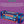 A boxed HARIBO Starmix candy product shown on a purple background with ingredient text above. The package is predominantly blue with red ribbon graphics, large red and white HARIBO branding, and smaller multicolor candy illustrations.