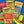 Assorted Haribo candy packages on a blue background with a cartoon bear character.