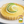 Lemon lime tart with lime slices on top and a jar of Mackay's Lime Curd.