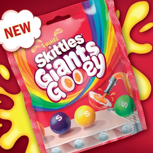 Skittles Giants Gooey candy package with colorful design on a red background