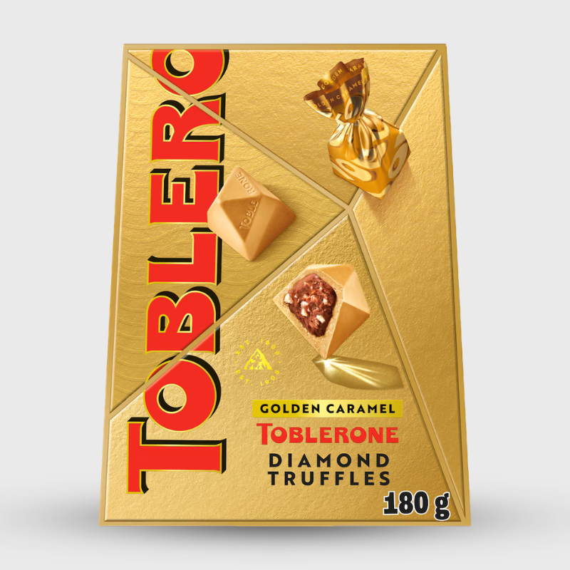 Gold Toblerone packaging with diamond truffles on a white background
