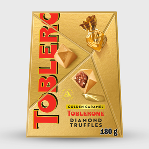 Gold Toblerone packaging with diamond truffles on a white background