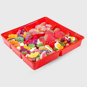 A red plastic divided candy tray filled with assorted gummy candies, shown on a light gray background.