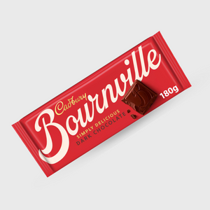 Cadbury Bournville Simply Delicious Dark Chocolate 180g bar in its signature red wrapper, shown at an angle on a light gray background.