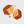 Chocolate-covered caramel pieces on a light gray background