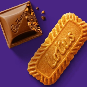 Cadbury chocolate bar and biscuit on a purple background