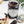 Jar of black currant preserve with a cake and jam on a white surface