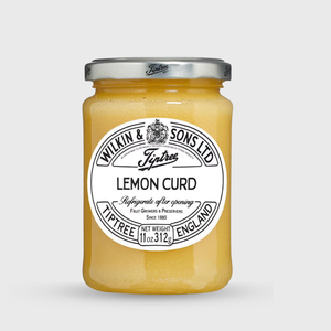 Jar of lemon curd with a label on a white background