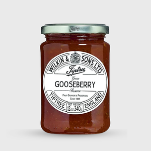 Jar of gooseberry preserve with a white label on a light gray background