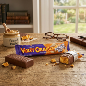Peanut butter bar with packaging on a wooden table with peanut butter and crackers.