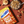 Weetabix Crispy Minis Chocolate Chip cereal box with a bowl of cereal and chocolate pieces on a brown background