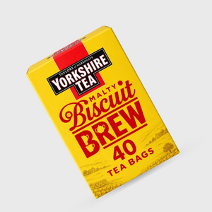 A yellow box of Yorkshire Biscuit Brew tea bags, angled on a light gray background.